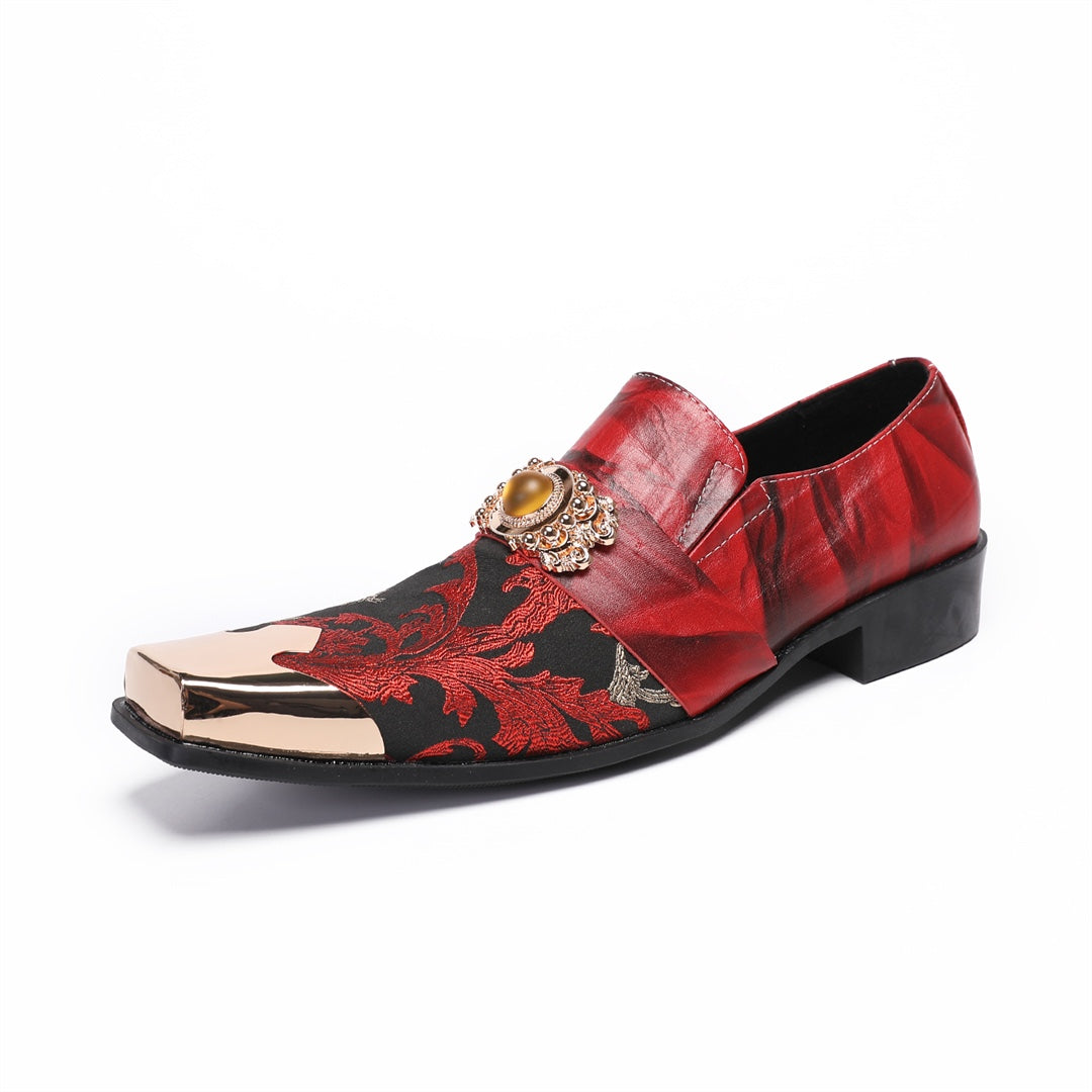 Pair of men's red and black floral slip-on loafers with gold metal square toe and decorative buckle.