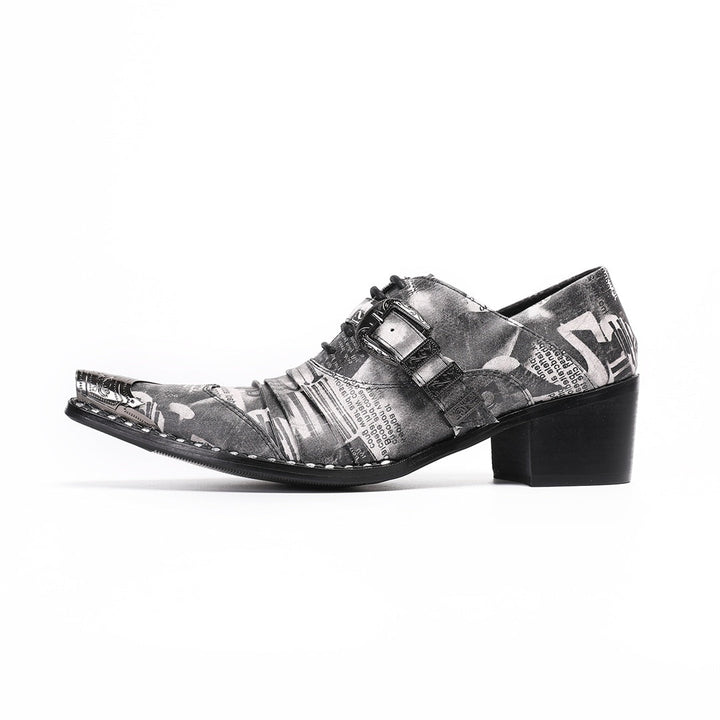 Pair of men's high heel derby shoes with a black and white newspaper print, pointed metal toe caps, and buckle details, shown