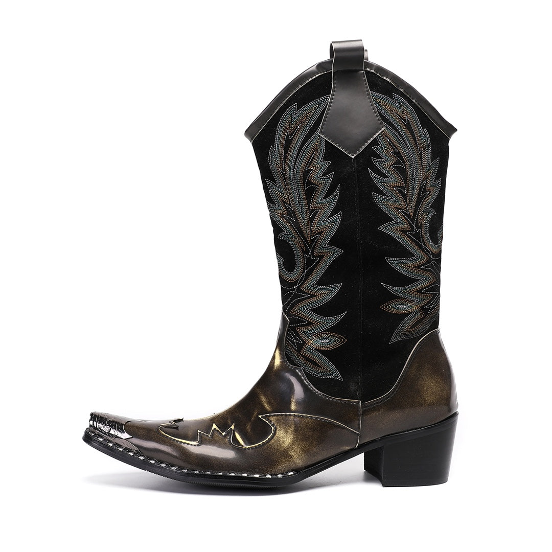 Pair of men's black and metallic bronze cowboy boots with intricate embroidery and a sharp pointed toe, shown against a white