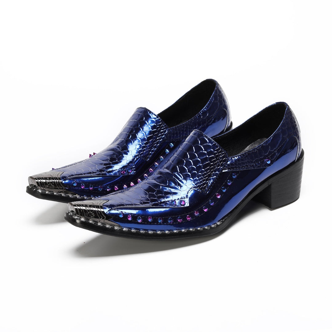 A pair of men's blue patent crocodile embossed slip-on shoes with a pointed metal toe and studded sole.