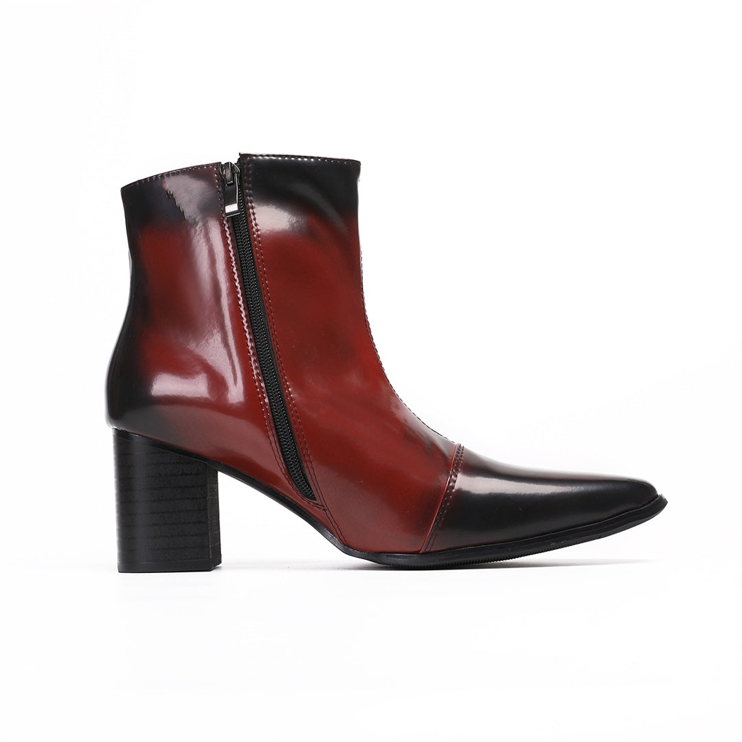 Pair of men's burnished red and black pointed toe ankle boots with a side zipper and sturdy block heel.