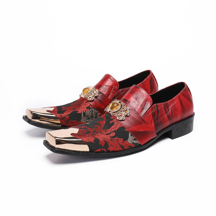Pair of men's red and black floral slip-on loafers with gold metal square toe and decorative buckle.
