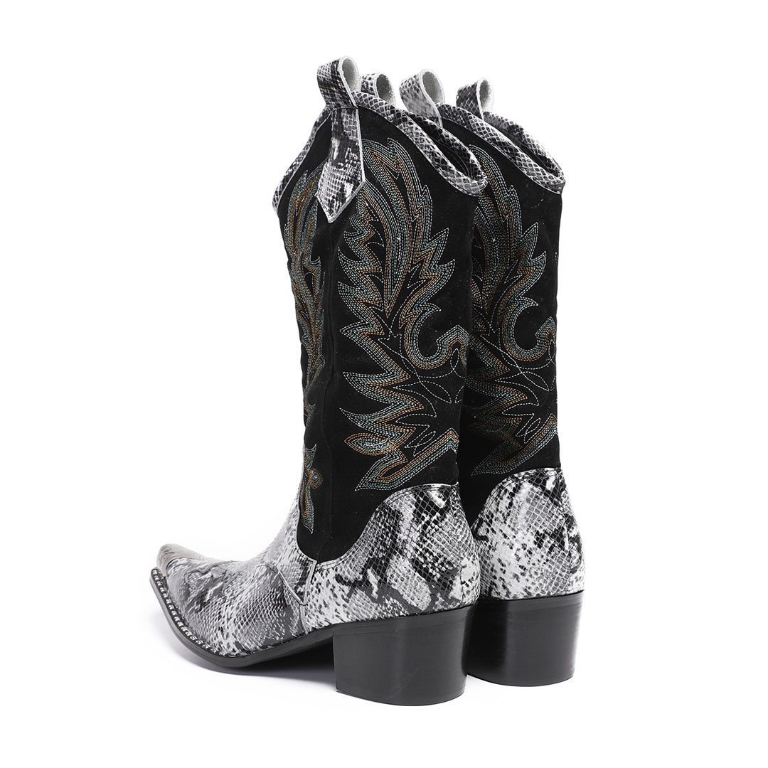 A pair of black and white snakeskin cowboy boots with an embroidered shaft and metal-tipped pointed toe.