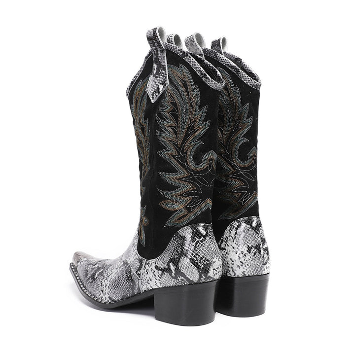 A pair of black and white snakeskin cowboy boots with an embroidered shaft and metal-tipped pointed toe.