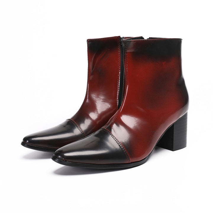 Pair of men's burnished red and black pointed toe ankle boots with a side zipper and sturdy block heel.