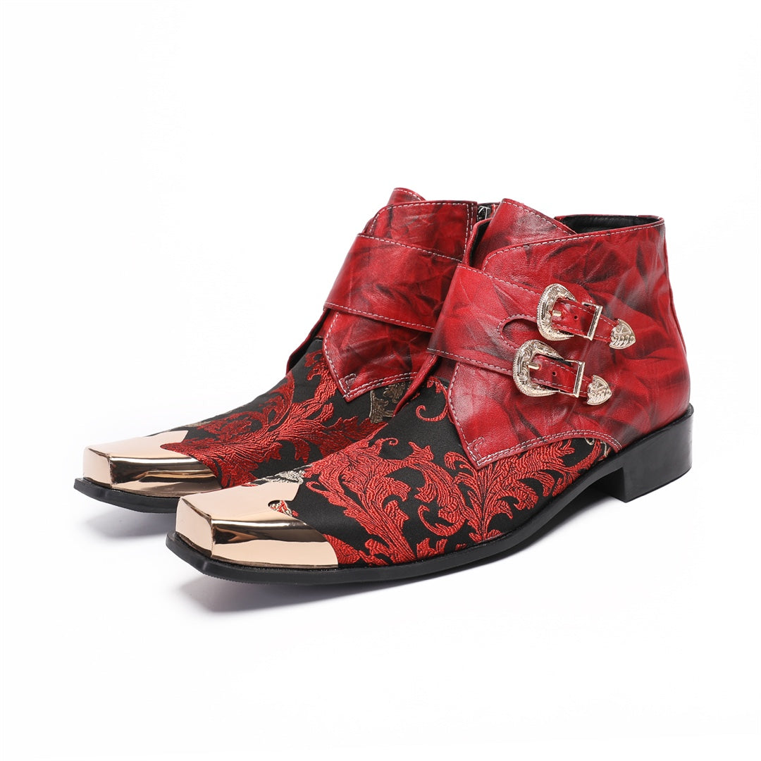 Pair of men's red and black embroidered ankle boots with gold metal square toe caps and double buckle straps.