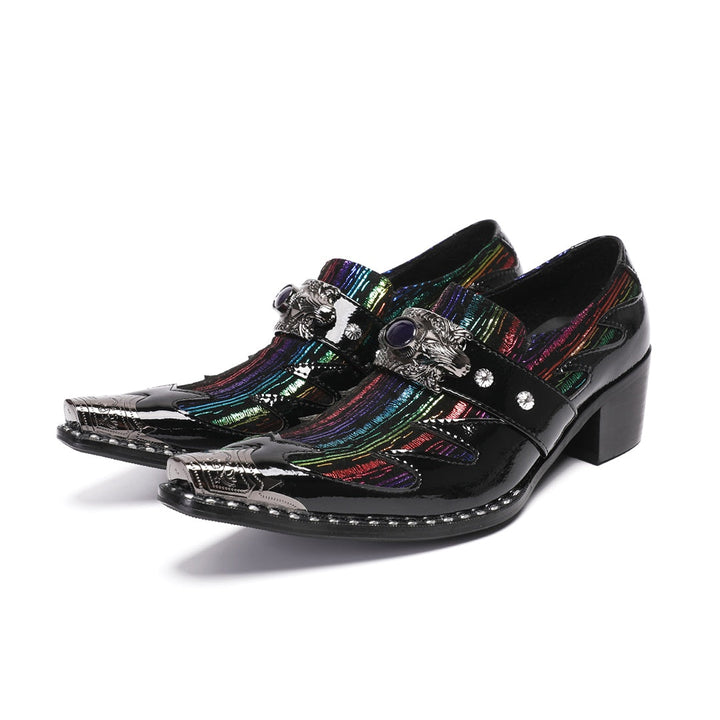 A single black patent leather men's dress shoe with a pointed metal toe, rainbow-striped vamp, and a decorative silver buckle