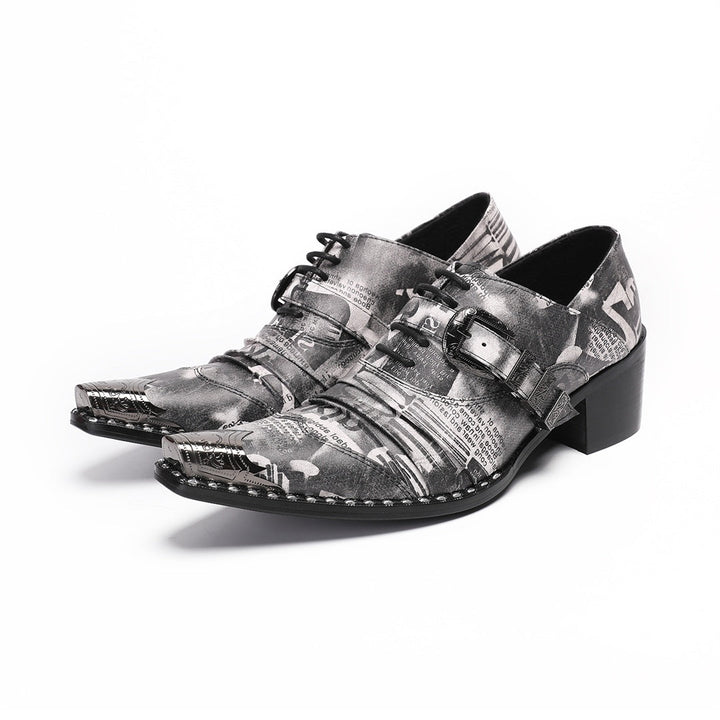 Pair of men's high heel derby shoes with a black and white newspaper print, pointed metal toe caps, and buckle details, shown