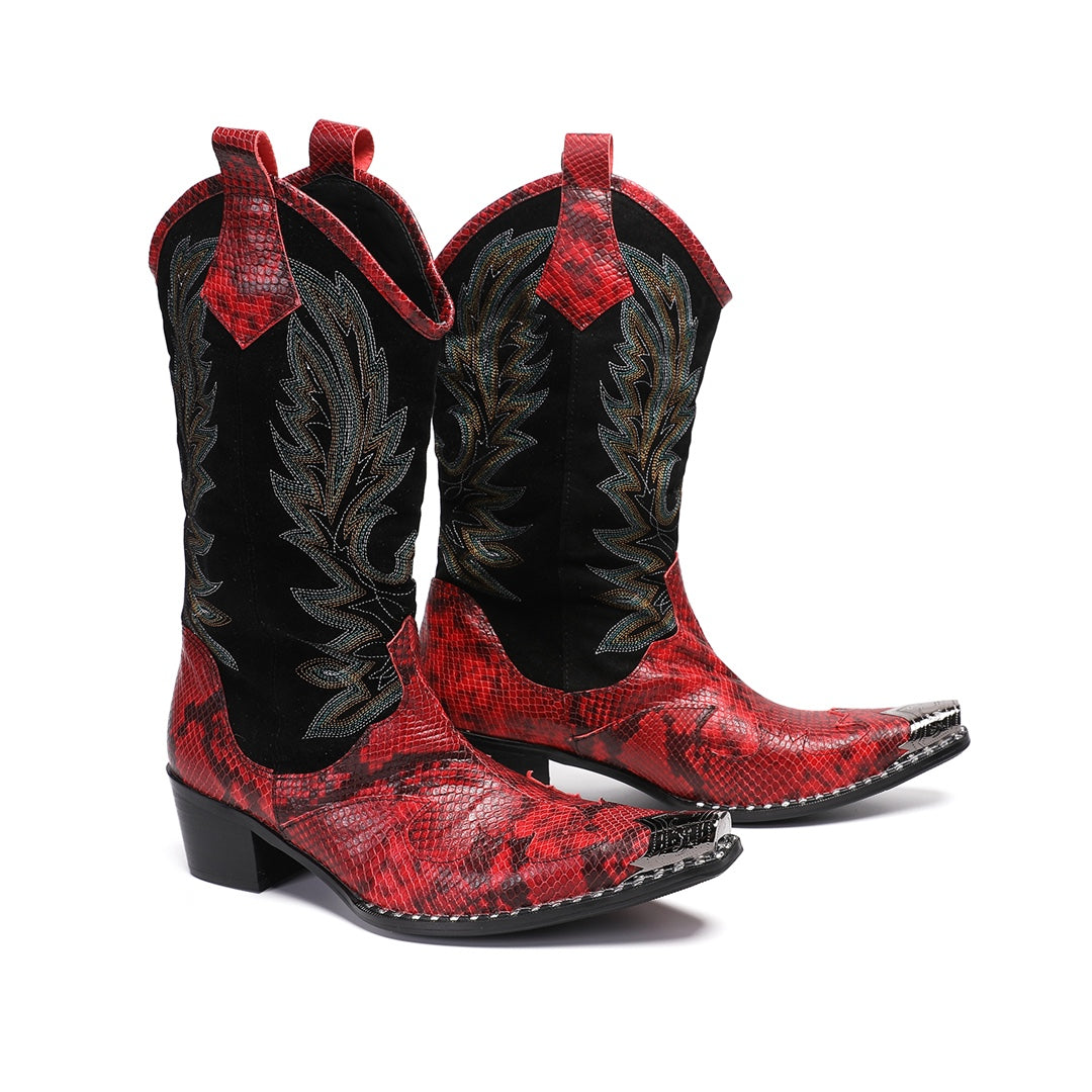Pair of men's red snakeskin western boots with black shafts, intricate embroidery, and silver metal toe caps on a white