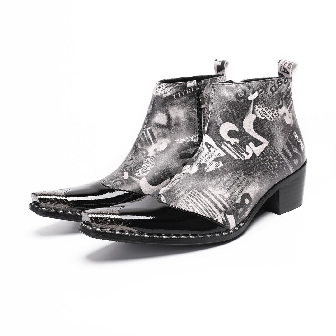 Pair of men's black and white newspaper print ankle boots with a shiny black pointed toe and silver metal tip, side zipper