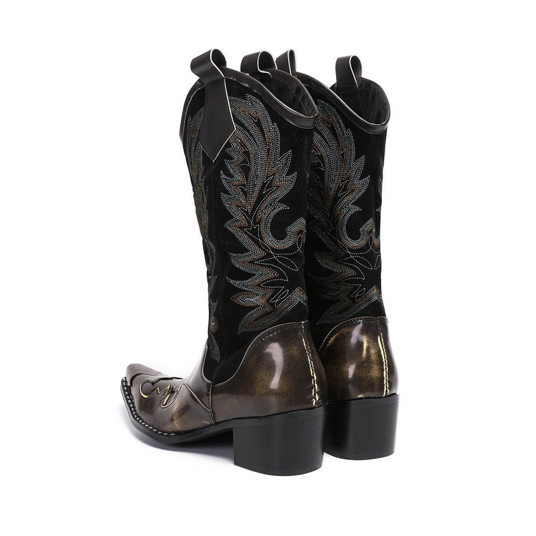 Pair of men's black and metallic bronze cowboy boots with intricate embroidery and a sharp pointed toe, shown against a white
