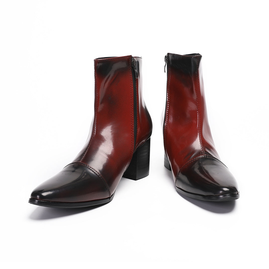 Pair of men's burnished red and black pointed toe ankle boots with a side zipper and sturdy block heel.