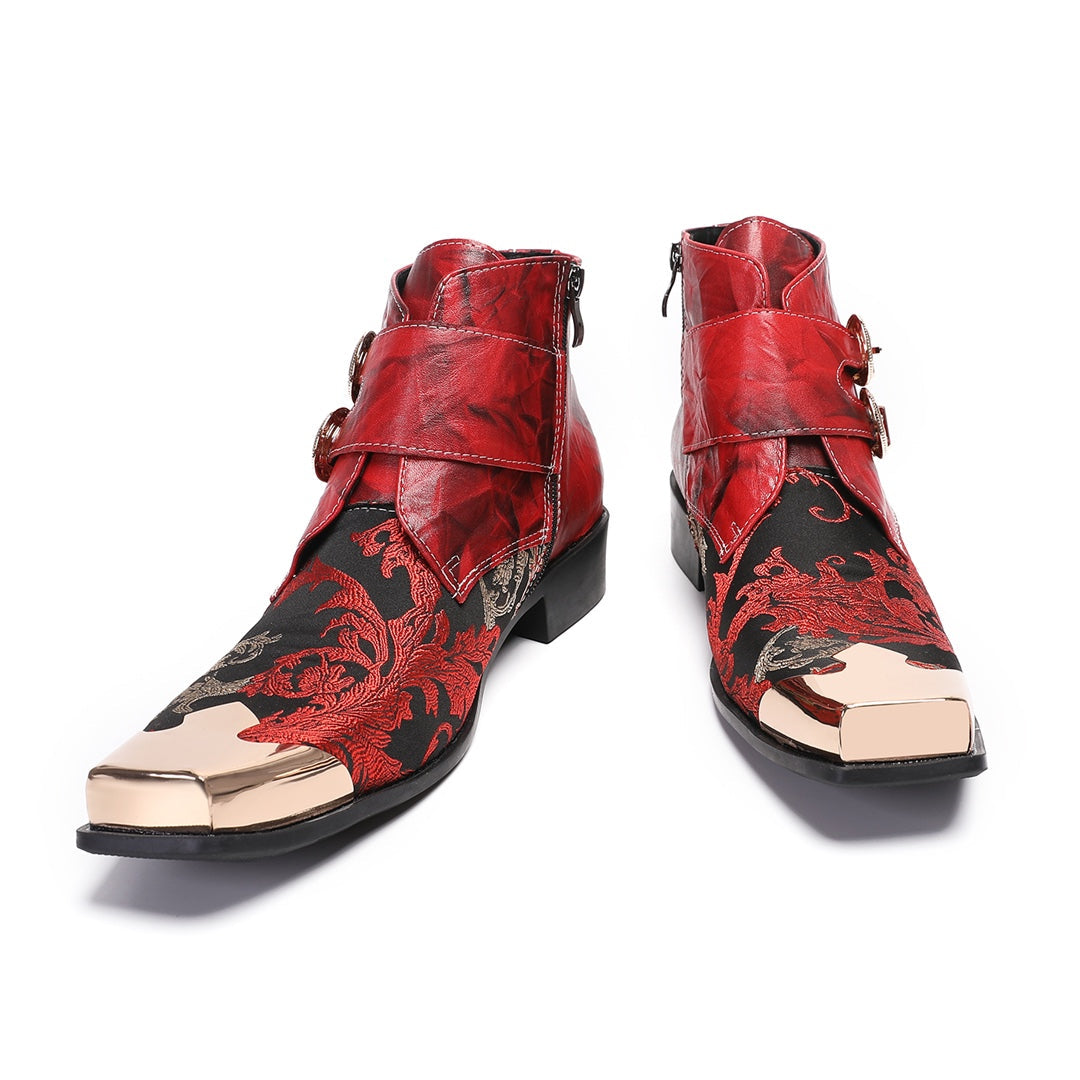 Pair of men's red and black embroidered ankle boots with gold metal square toe caps and double buckle straps.