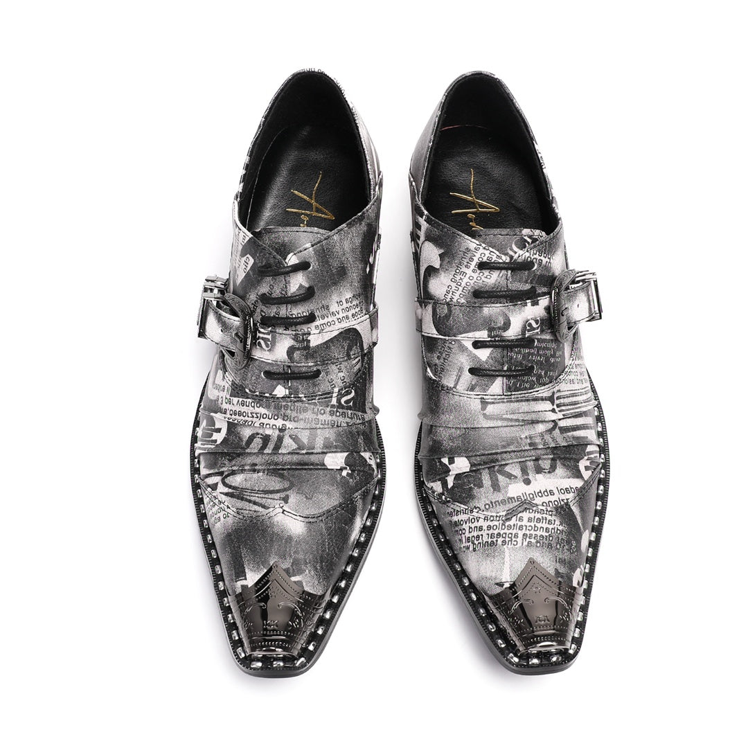 A pair of Dolashoes men's pointed toe lace-up shoes with a gray newspaper print, metal toe cap, and block heel.
