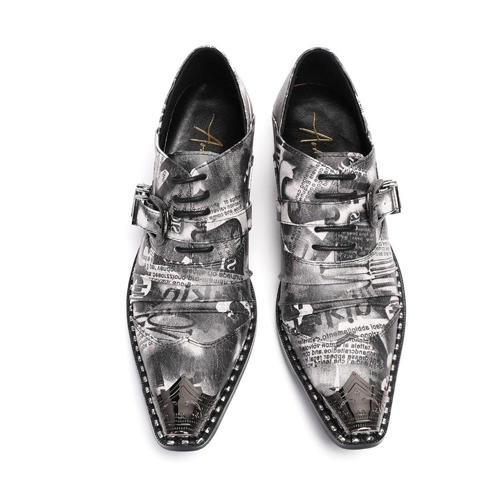 A pair of Dolashoes men's pointed toe lace-up shoes with a gray newspaper print, metal toe cap, and block heel.