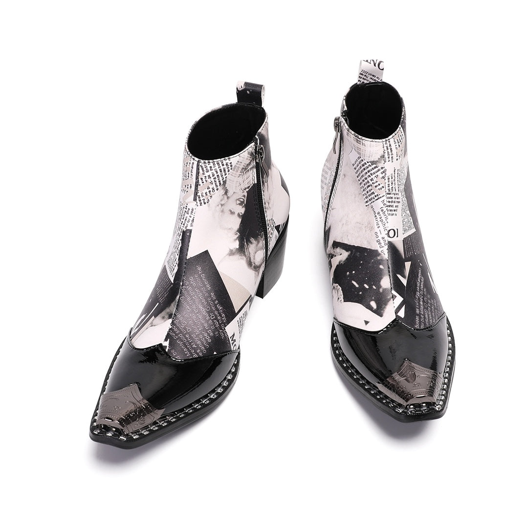 Pair of men's black and white newspaper print ankle boots with pointed patent leather toe and metal tip, side zipper, and