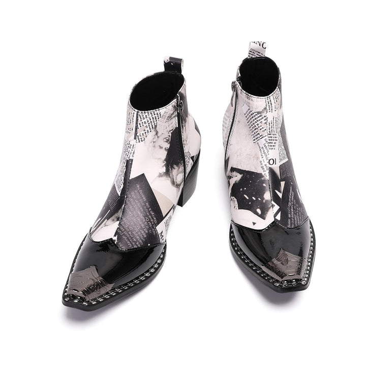 Pair of men's black and white newspaper print ankle boots with pointed patent leather toe and metal tip, side zipper, and