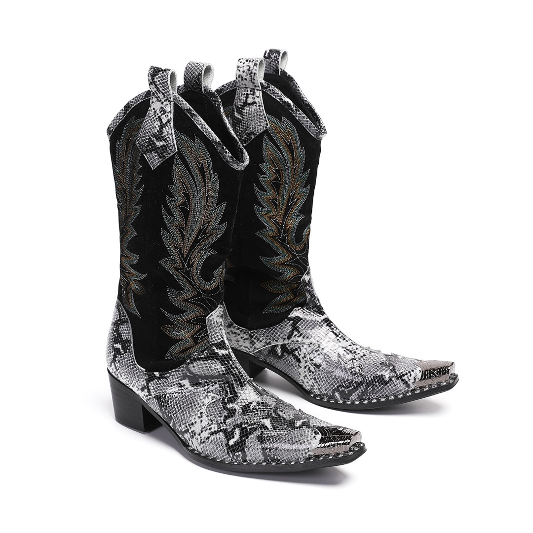 A pair of black and white snakeskin cowboy boots with an embroidered shaft and metal-tipped pointed toe.