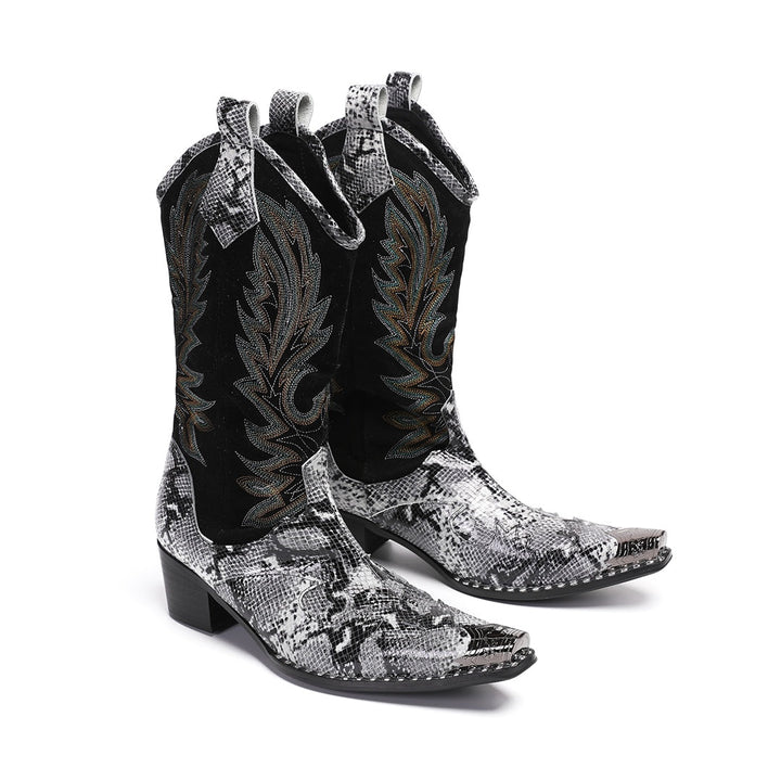 A pair of black and white snakeskin cowboy boots with an embroidered shaft and metal-tipped pointed toe.