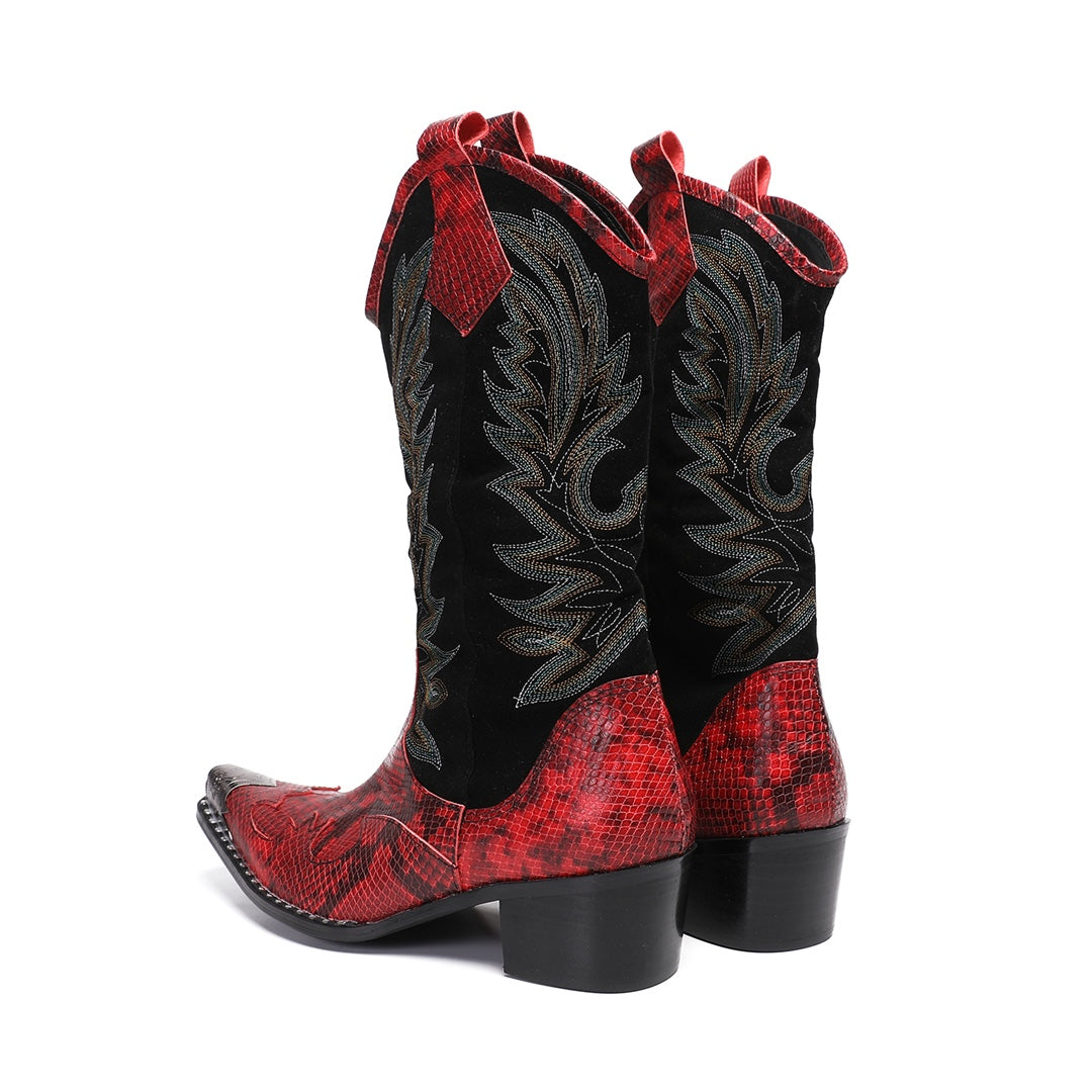Pair of men's red snakeskin western boots with black shafts, intricate embroidery, and silver metal toe caps on a white