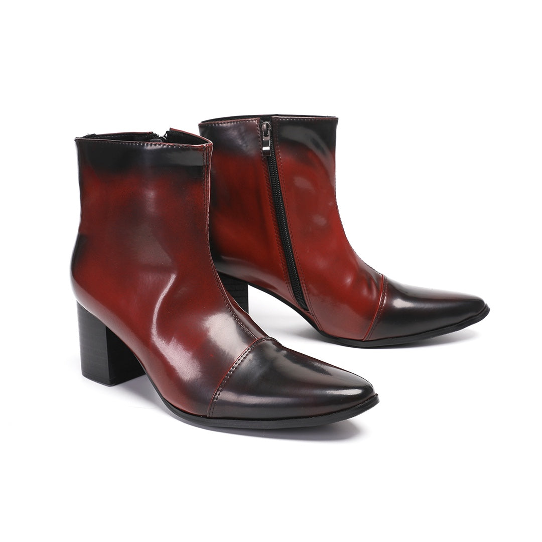 Pair of men's burnished red and black pointed toe ankle boots with a side zipper and sturdy block heel.