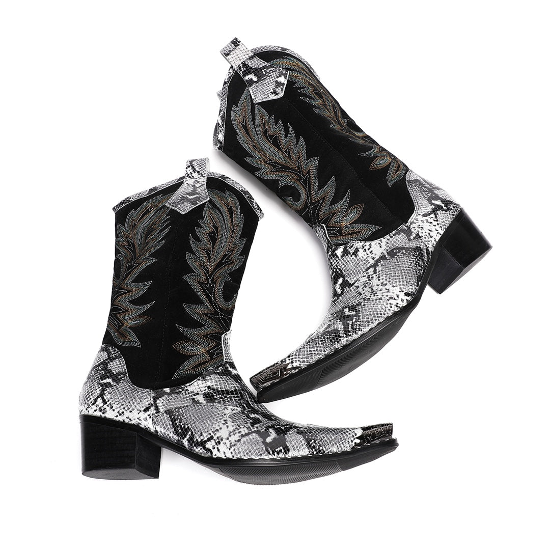 A pair of black and white snakeskin cowboy boots with an embroidered shaft and metal-tipped pointed toe.