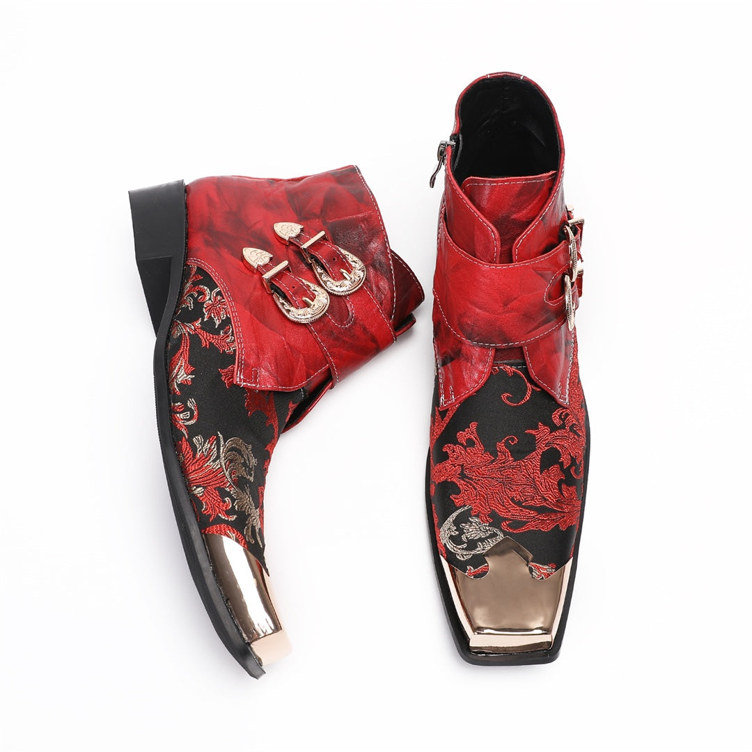 Pair of men's red and black embroidered ankle boots with gold metal square toe caps and double buckle straps.
