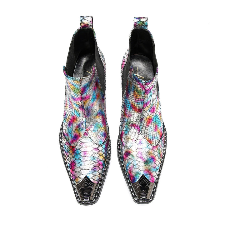 A pair of multi-color iridescent snakeskin Chelsea ankle boots with pointed metal toe caps and black block heels.