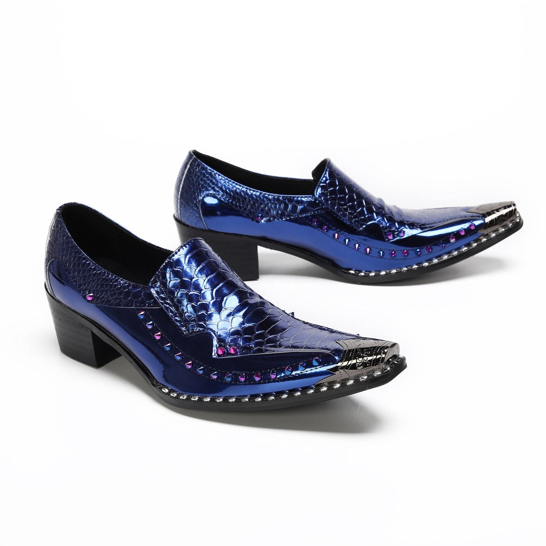 A pair of men's blue patent crocodile embossed slip-on shoes with a pointed metal toe and studded sole.