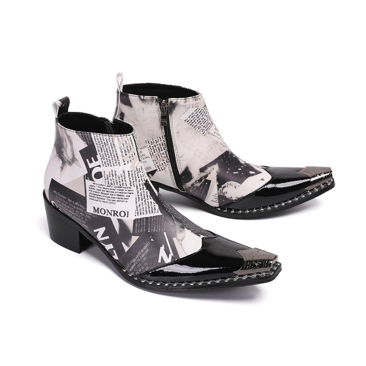 Pair of men's black and white newspaper print ankle boots with pointed patent leather toe and metal tip, side zipper, and