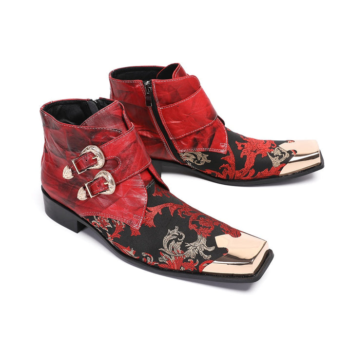 Pair of men's red and black embroidered ankle boots with gold metal square toe caps and double buckle straps.