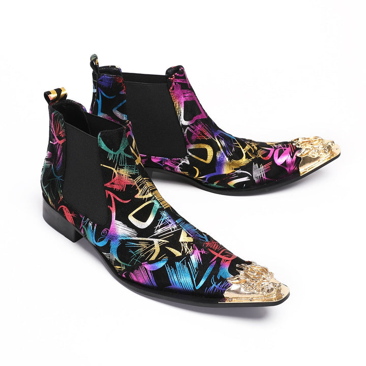 Pair of men's black Chelsea boots with a vibrant multi-color graffiti pattern and a gold metal pointed toe cap, shown from
