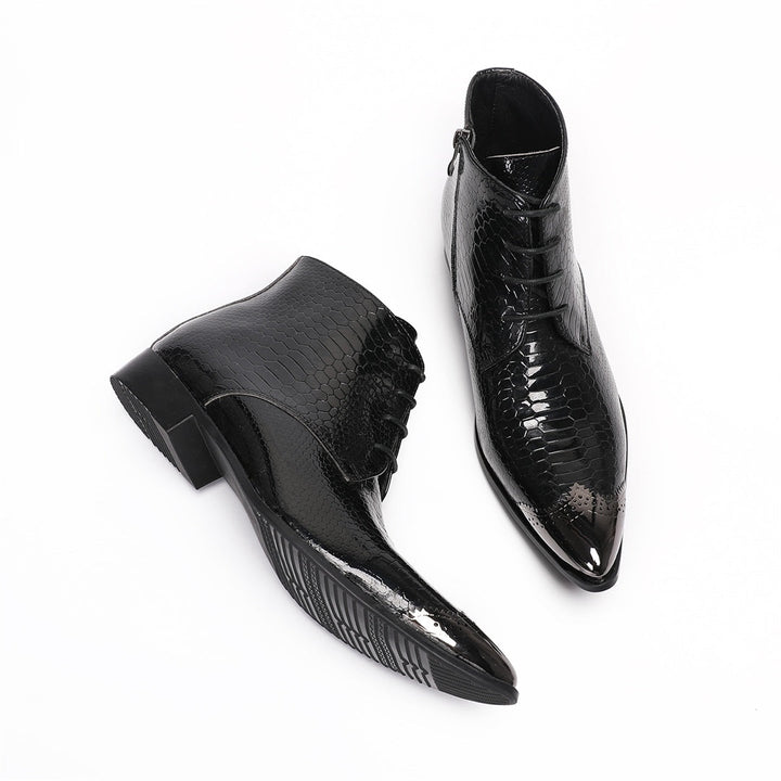Pair of men's black snakeskin embossed ankle boots with a shiny metal pointed toe cap, lace-up front, and side zipper.