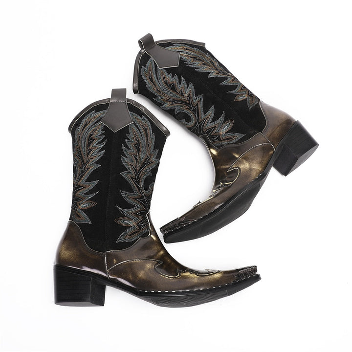 Pair of men's black and metallic bronze cowboy boots with intricate embroidery and a sharp pointed toe, shown against a white