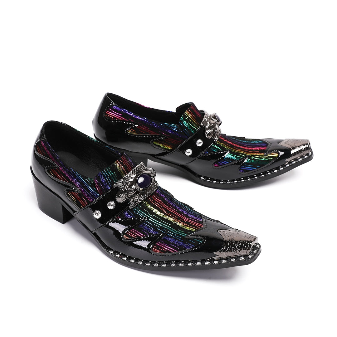 A single black patent leather men's dress shoe with a pointed metal toe, rainbow-striped vamp, and a decorative silver buckle